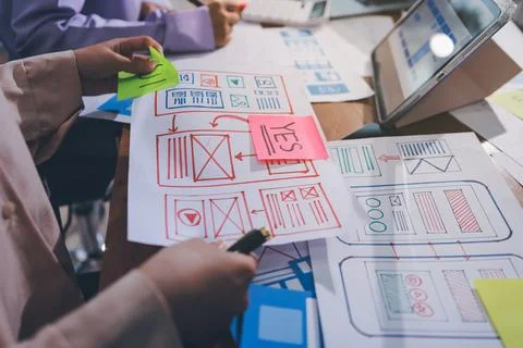 Close up ux developer and ui designer brainstorming about mobile app interf.. Foto stock