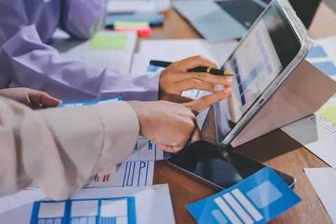 Close up ux developer and ui designer brainstorming about mobile app interf.. Foto stock