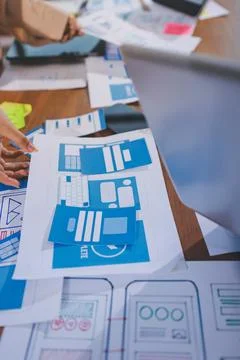 Close up ux developer and ui designer brainstorming about mobile app interf.. Stock Photos