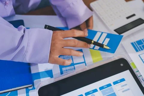 Close up ux developer and ui designer brainstorming about mobile app interf.. Stock Photos