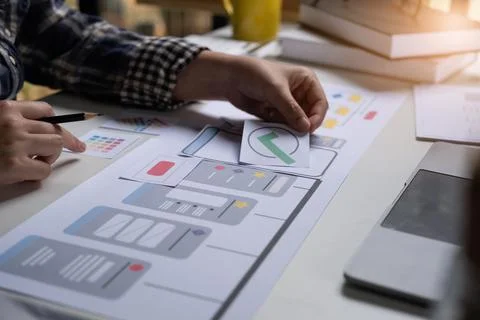 A close-up of an ux ui developer and an ui designer working on a mockup icon Foto stock