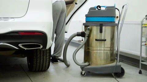 Close-up of the vacuum cleaner to clean the car interior at the car wash. 4K 库存影片 103260090