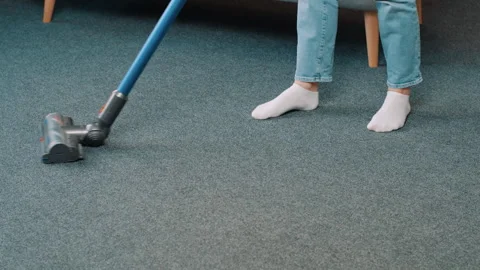 Close up of vacuum cleaner vacuuming carpet in modern apartment Stock-Footage 248002007