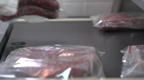 Close-up vacuum packaging of sausages Stockbeeldmateriaal 49229276