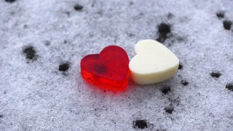 Close-up, Valentine's Day concept, two hearts in the snow, copy space, 4K Stock Footage 147875505