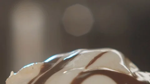 Close-up on vanilla ice cream with chocolate poured with slow motion chips Stock Footage 113864628