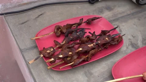 Close-up of various anticuchos on a plate Видео 143374945