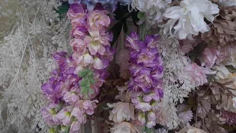 Close-Up of Various Colored Plastic Flower Decorations Stock Footage 291907751