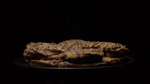 Close-up of various cookies in rotation. Black background. Stock Footage 101406435