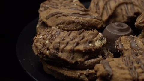 Close-up of various cookies in rotation. Black background. Stock Footage 101406885