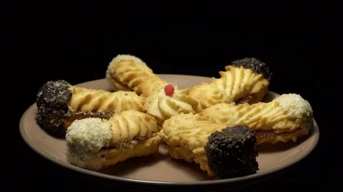 Close-up of various cookies in rotation. Black background. Stock Footage 101407861
