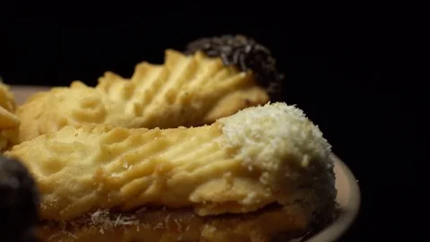 Close-up of various cookies in rotation. Black background. Stock Footage 101407863