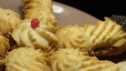 Close-up of various cookies in rotation. Black background. Stock Footage 101407918