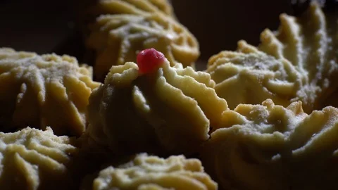 Close-up of various cookies in rotation. Black background. Stock Footage 101407965