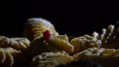 Close-up of various cookies in rotation. Black background. Stock Footage 101408041