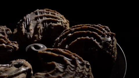 Close-up of various cookies in rotation. Black background. Stock Footage 101408046