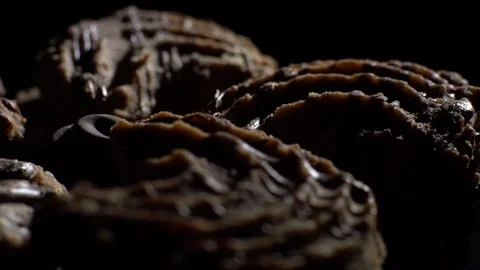 Close-up of various cookies in rotation. Black background. Stock Footage 101408055