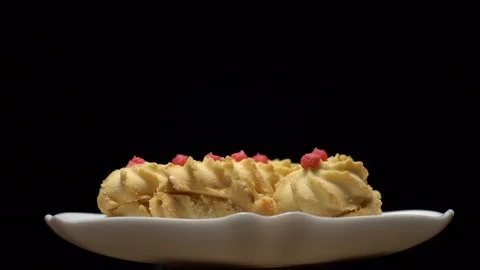 Close-up of various cookies in rotation. Black background. Stock Footage 101408212