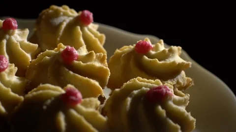 Close-up of various cookies in rotation. Black background. Stock Footage 101408307