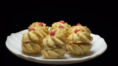 Close-up of various cookies in rotation. Black background. Stock Footage 101408333