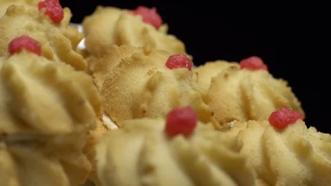 Close-up of various cookies in rotation. Black background. Stock Footage 101408414