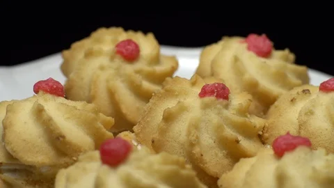 Close-up of various cookies in rotation. Black background. Stock Footage 101408431