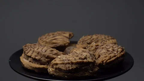 Close-up of various cookies in rotation. grey background. Stock Footage 101406792