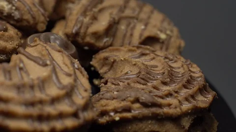 Close-up of various cookies in rotation. grey background. Stock Footage 101407120