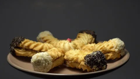 Close-up of various cookies in rotation. grey background. Stock Footage 101407185