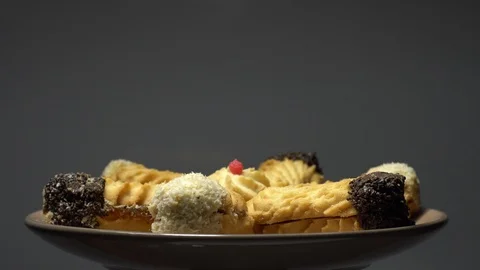 Close-up of various cookies in rotation. grey background. Stock Footage 101407363