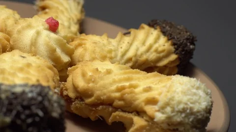 Close-up of various cookies in rotation. grey background. Stock Footage 101407496