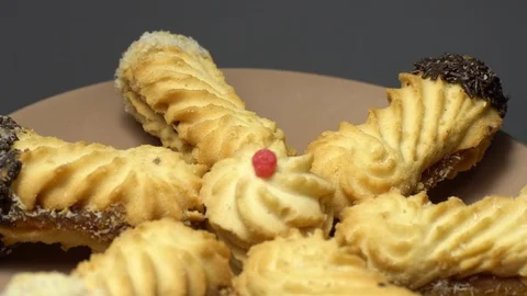 Close-up of various cookies in rotation. grey background. Stock Footage 101407506
