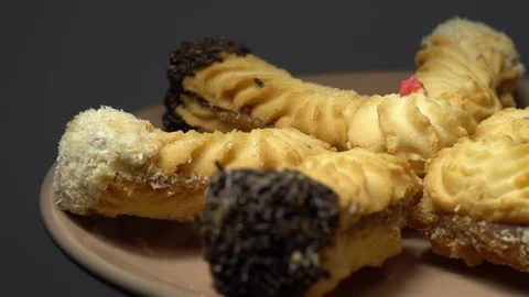 Close-up of various cookies in rotation. grey background. Stock Footage 101407555