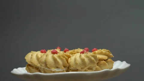 Close-up of various cookies in rotation. grey background. Stock Footage 101408311