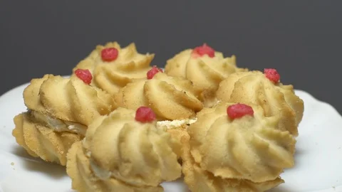 Close-up of various cookies in rotation. grey background. Stock Footage 101408594