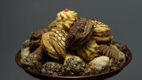 Close-up of various cookies in rotation. grey background. Stock Footage 101408911