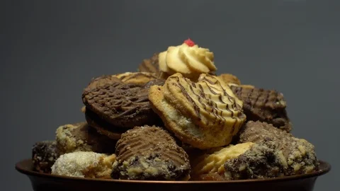 Close-up of various cookies in rotation. grey background. Stock Footage 101408976