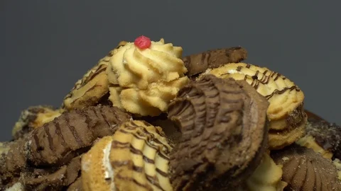 Close-up of various cookies in rotation. grey background. Stock Footage 101408986