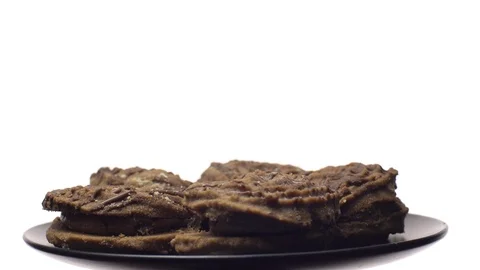 Close-up of various cookies in rotation. isolated on white. Stock Footage 101406705