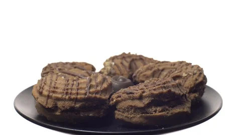 Close-up of various cookies in rotation. isolated on white. Stock Footage 101406776