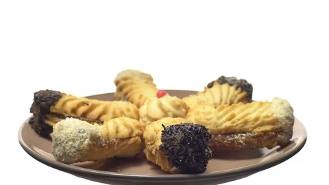 Close-up of various cookies in rotation. isolated on white. Stock Footage 101407101