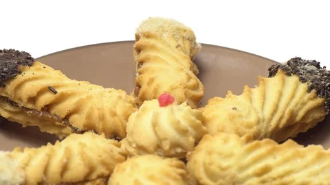 Close-up of various cookies in rotation. isolated on white. Stock Footage 101407545