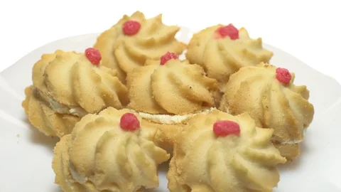 Close-up of various cookies in rotation. isolated on white. Stock Footage 101408530