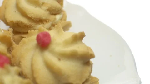 Close-up of various cookies in rotation. isolated on white. Stock Footage 101408901