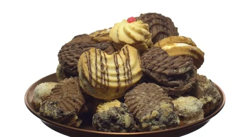 Close-up of various cookies in rotation. isolated on white. Stock Footage 101408954