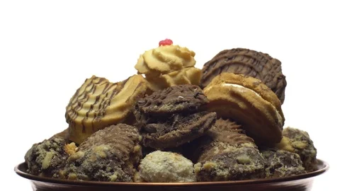 Close-up of various cookies in rotation. isolated on white. Stock Footage 101408965
