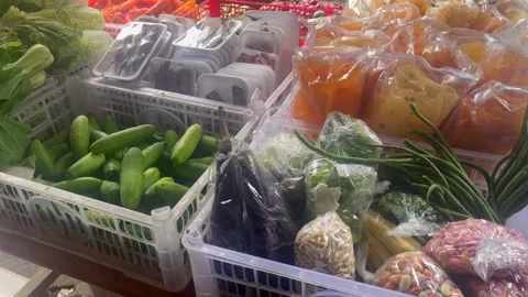 Close up of various fresh vegetables and snacks displayed in crates. Stock Footage 323720344