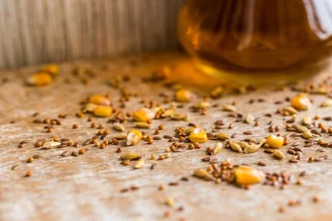 Close up various grains scattered on table and oil Stock Photos