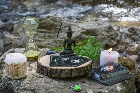 Close-up of various objects for rituals and divination on a large stone again Stock Photos