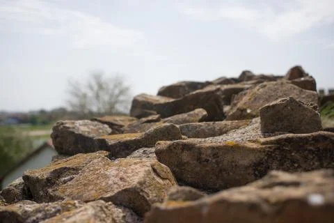 Close up of various shaped stone wall of medieval fortress.Top of various sha Fotos de archivo